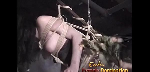  Tied up suspended slave dominated by her kinky redhead friend